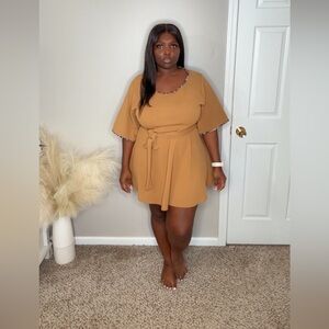 Tan dress with leopard lining on arms and neck